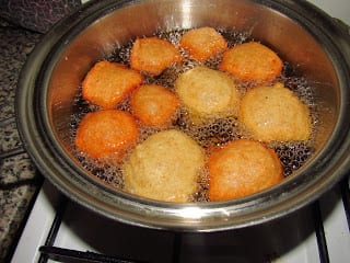 Hot pot of akara frying on a stove